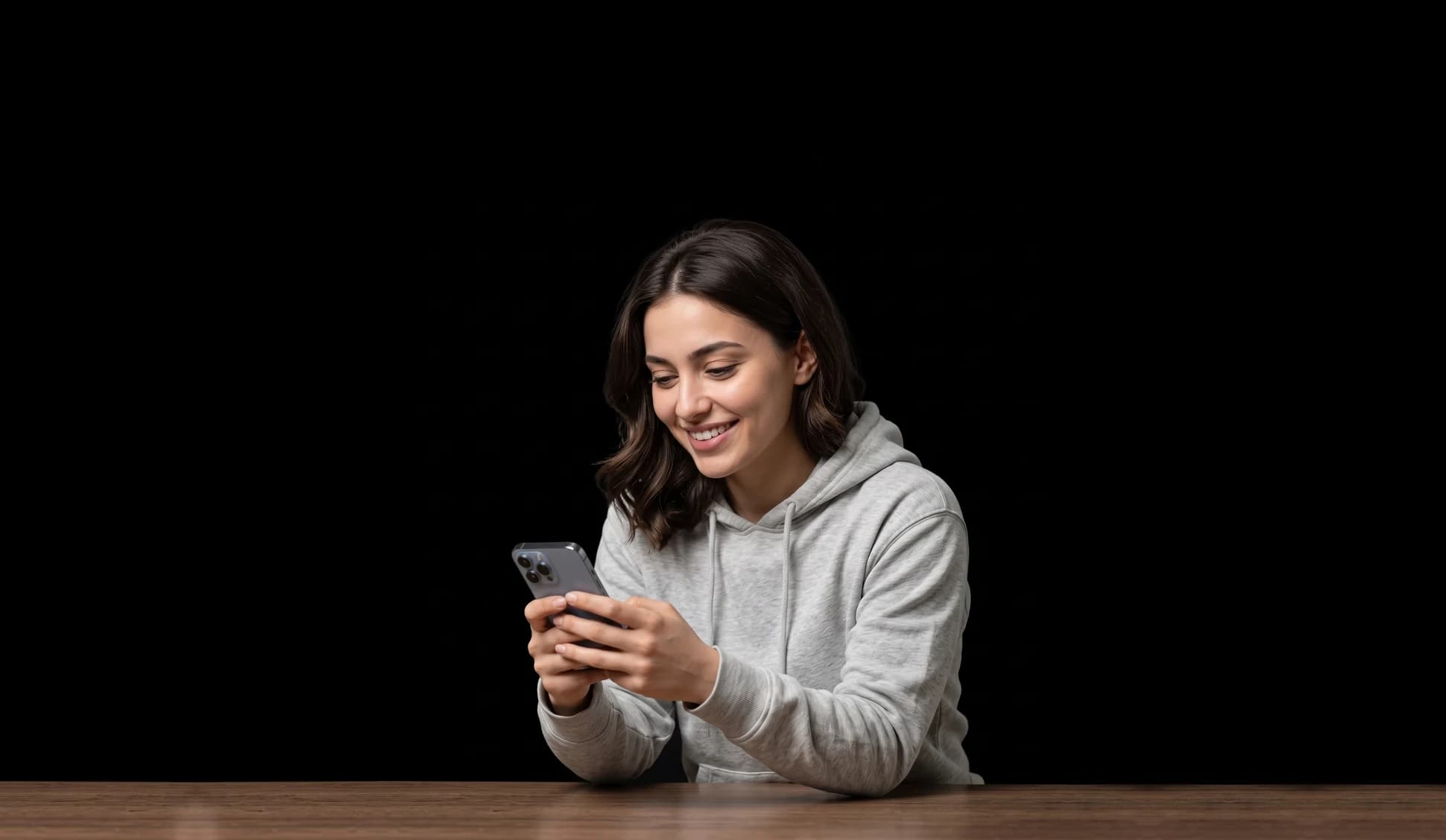 Student holding smartphone and smiling